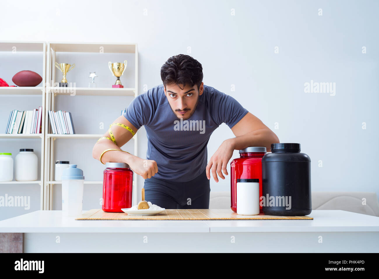 Athlete tasting new protein supplements for better muscles Stock Photo Alamy