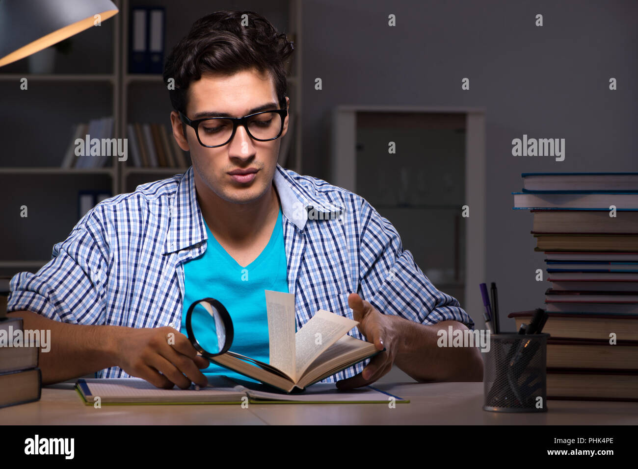 Student preparing for exams late night at home Stock Photo - Alamy