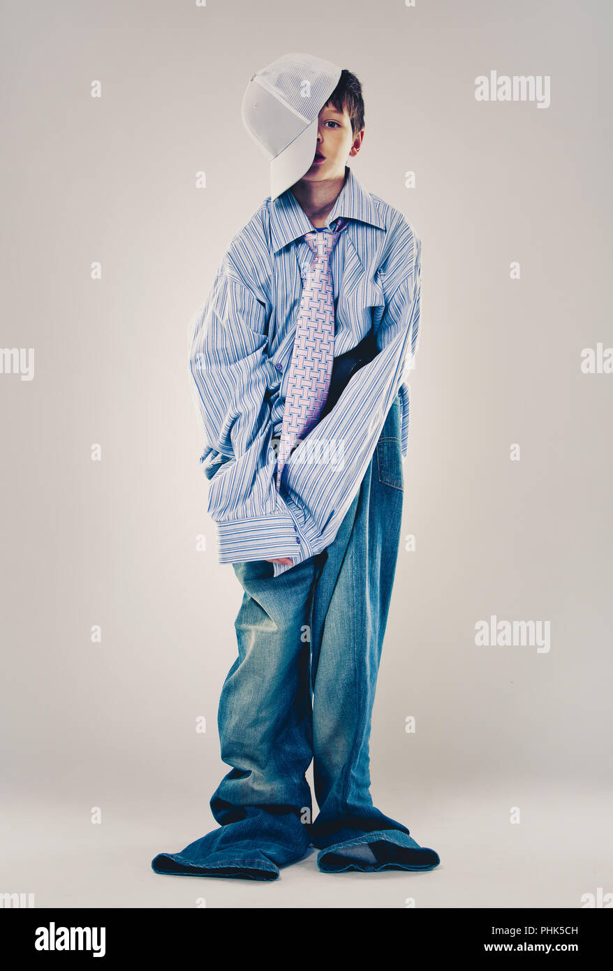 funny boy wearing Dad's clothes Stock Photo