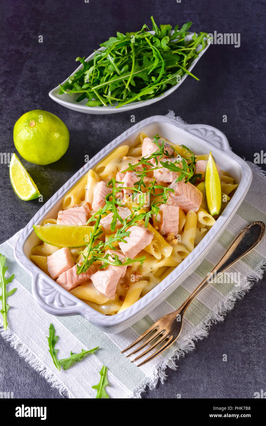 Salmon with penne noodle and arugula Stock Photo - Alamy
