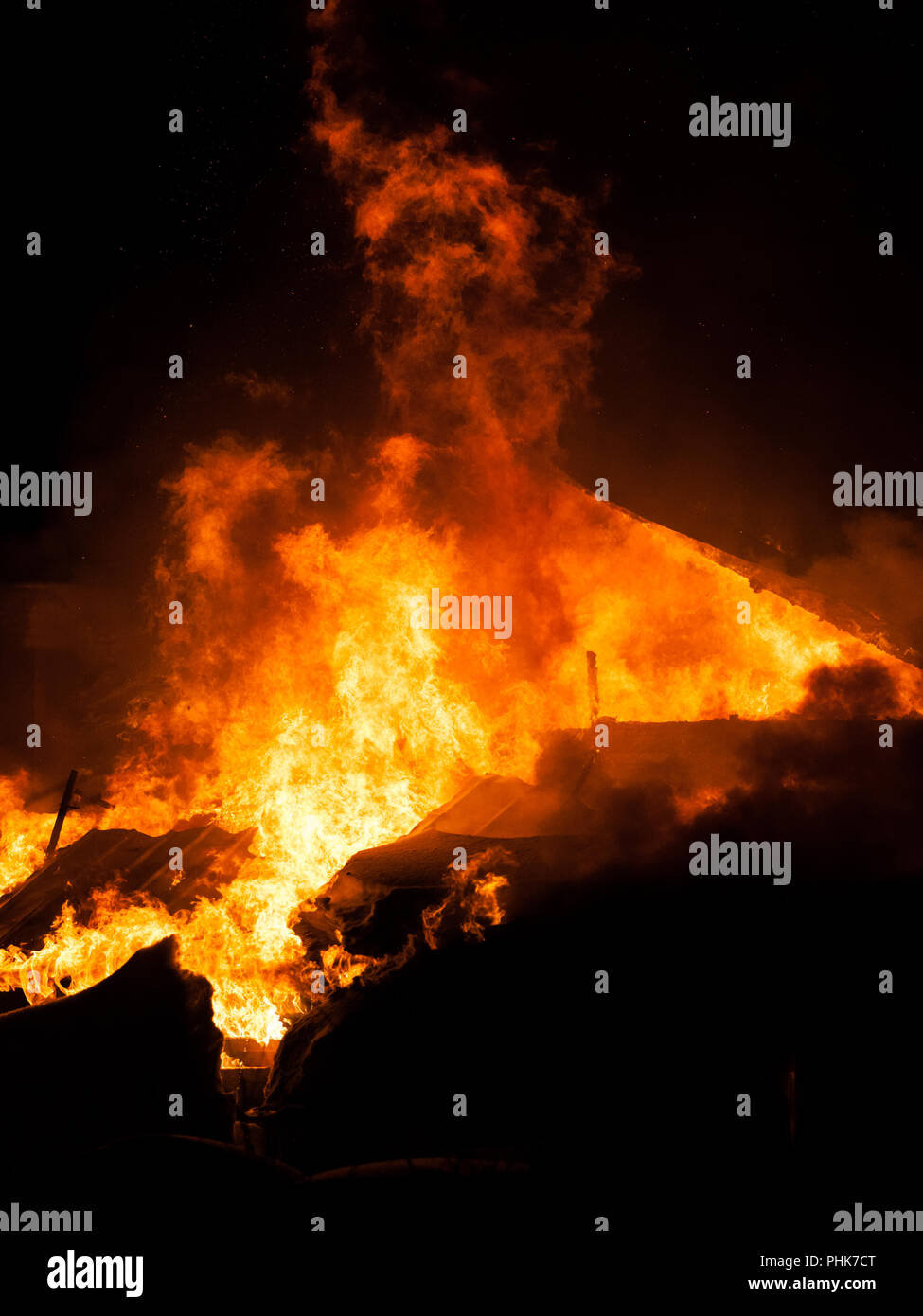 Burning fire flame on wooden house roof Stock Photo Alamy