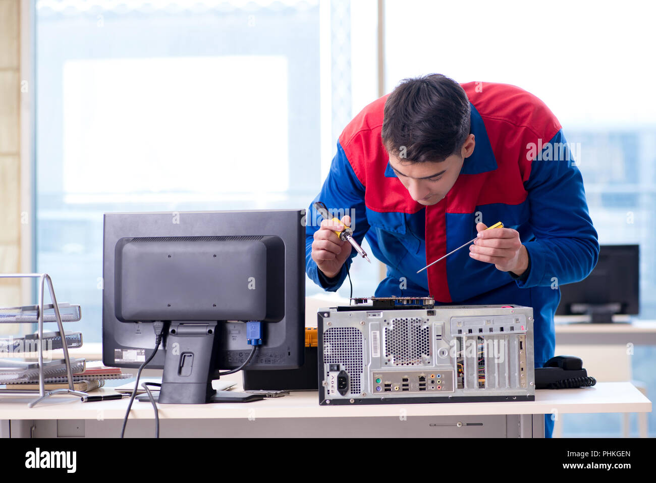 Computer repairman specialist repairing computer desktop Stock Photo ...