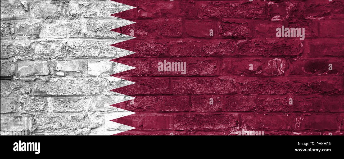 Flag of Qatar over an old brick wall background, surface Stock Photo ...