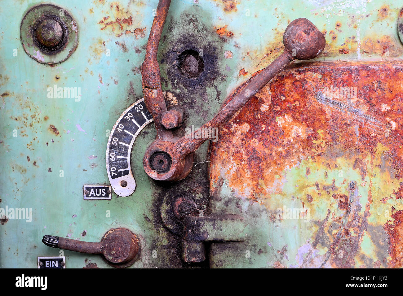 Lever on an old machine on a deserted company site Stock Photo