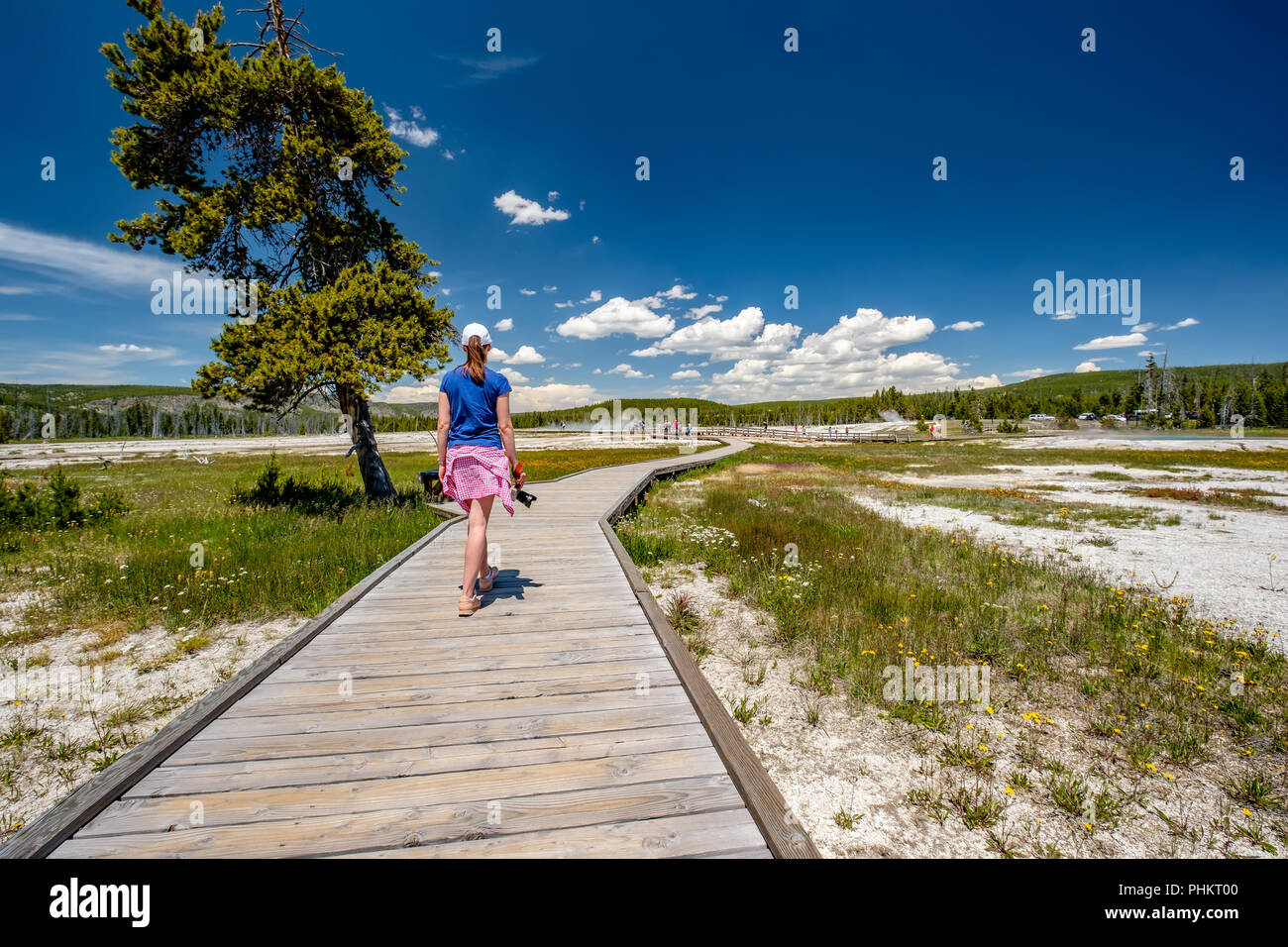 Tourist with camera hiking in Yellowstone Stock Photo - Alamy