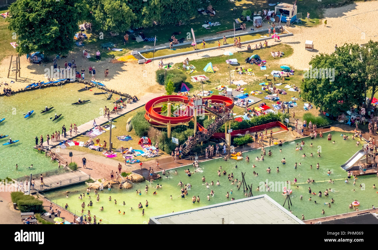 Aerial photo, aerial view of the natural swimming pool Mülheim-Styrum, red water slide, outdoor swimming pool with outdoor pool on the last day of hol Stock Photo