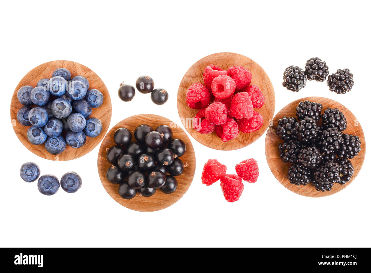 blackberry blueberry raspberry black currant in wooden bowl isolated on ...