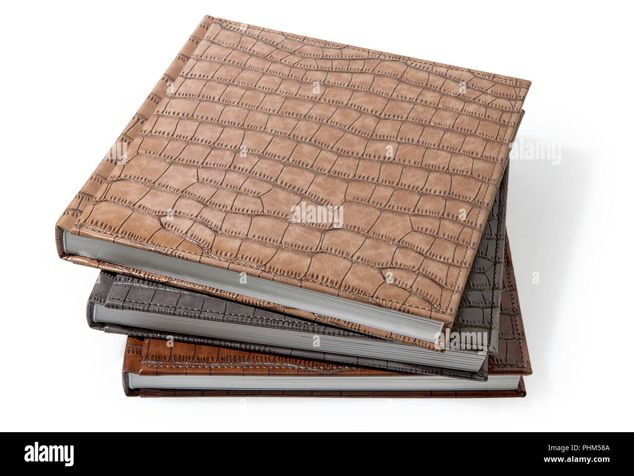 hardcover books lying on a white background Stock Photo