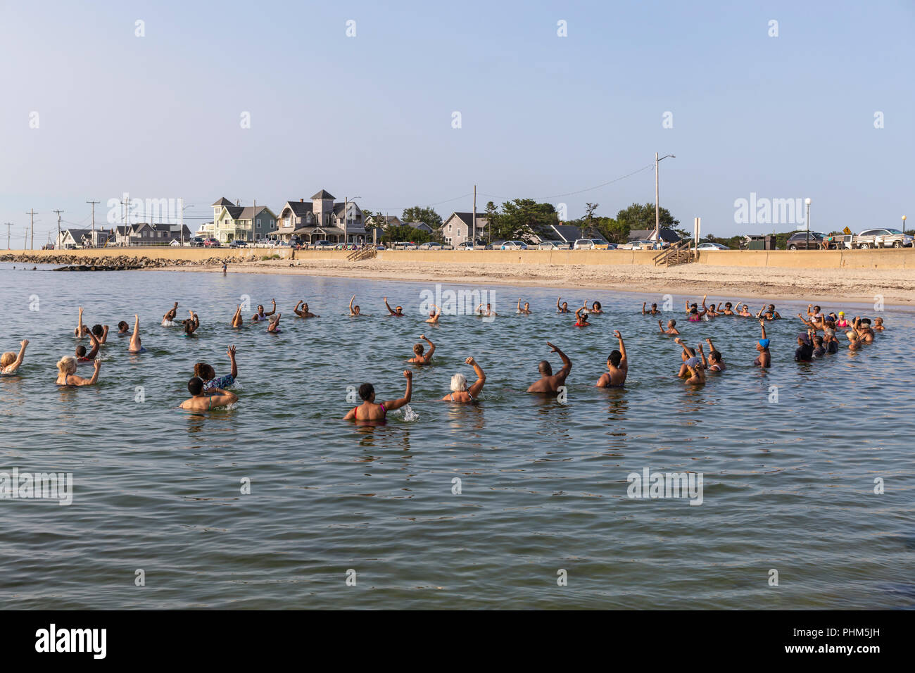 The 'Polar Bears' gather for a morning swim, exercise, and prayer in the water off Inkwell Beach in Oak Bluffs, Massachusetts on Martha's Vineyard. Stock Photo