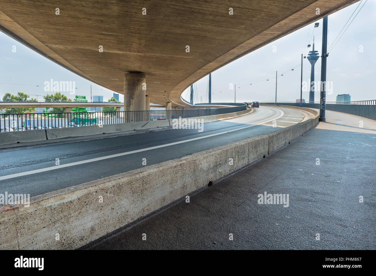 View of Rhine Tower fom the roads merging onto the Rheinkniebrücke ...