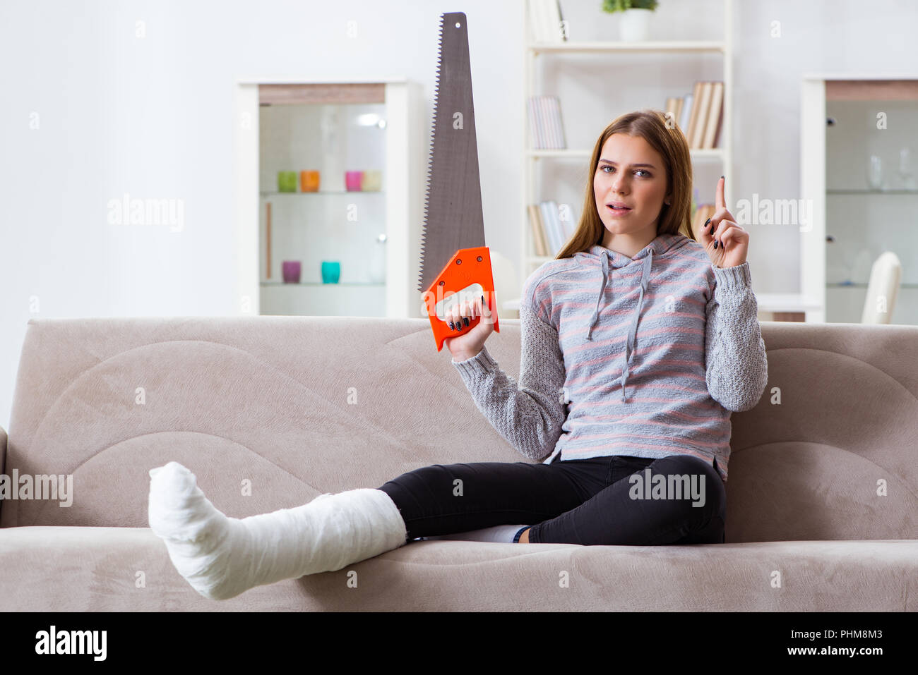 Young woman with broken leg at home Stock Photo Alamy