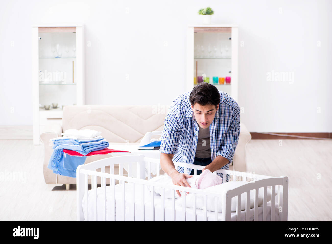 Young dad looking after newborn baby Stock Photo