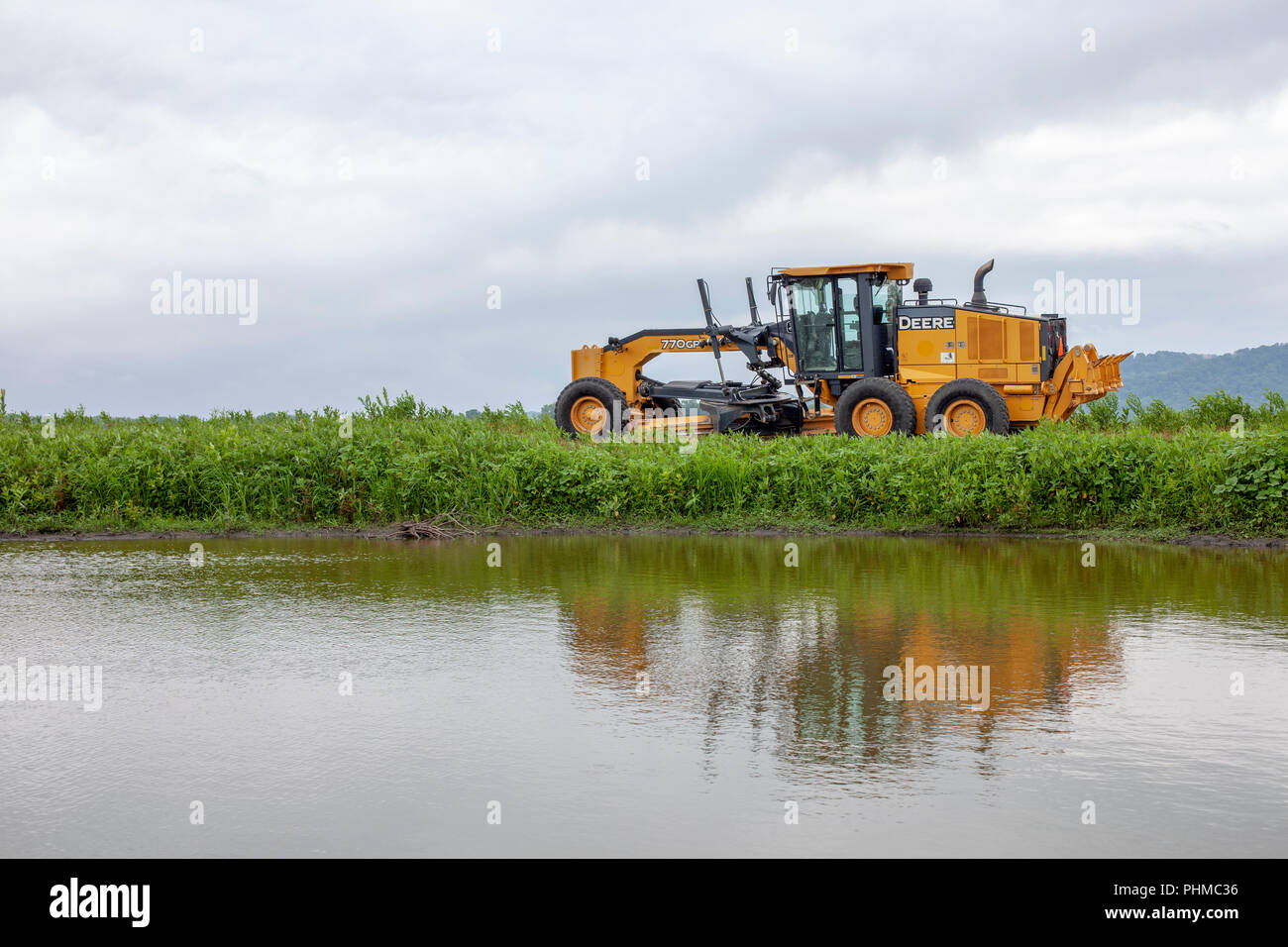 A John Deere 770GP Motor Grader stands by at the Clarence Cannon National Wildlife Refuge Area in Pike County, Missouri. Stock Photo