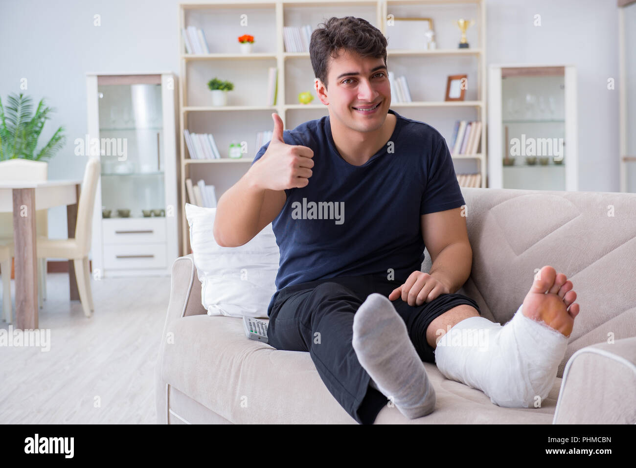 Man with broken leg recovering at home Stock Photo - Alamy