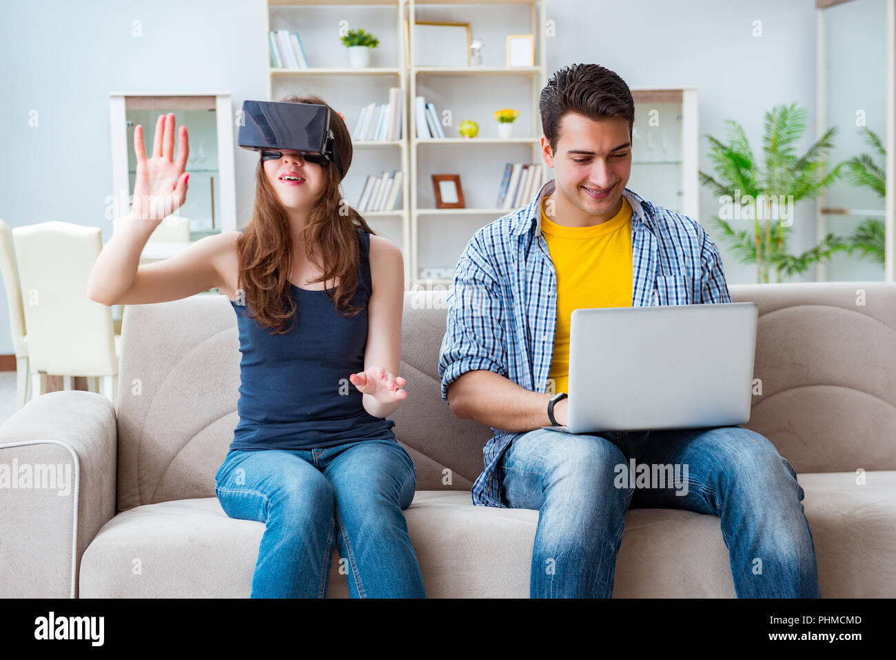 Young family playing games with virtual reality glasses Stock Photo - Alamy