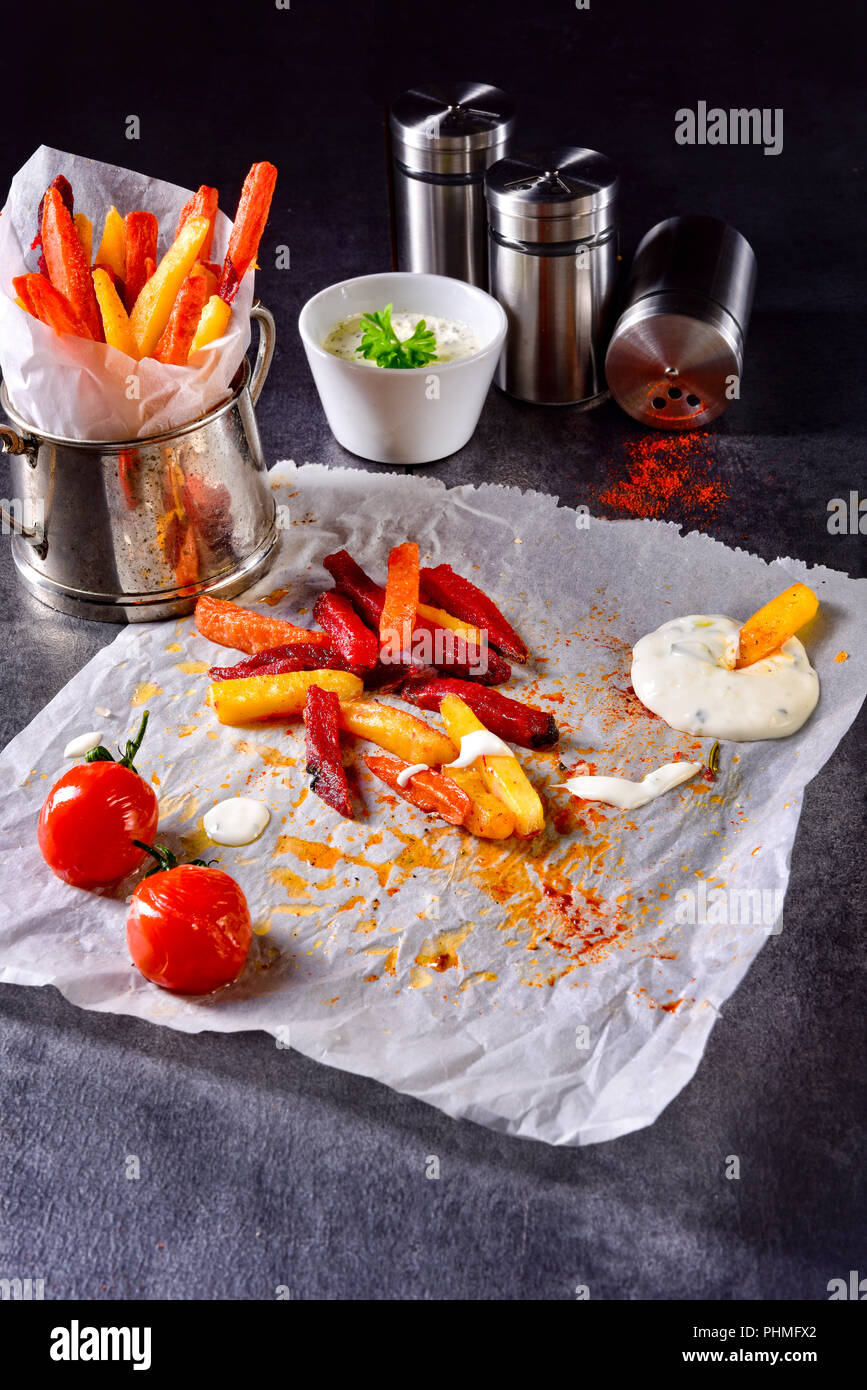 vegetable French fries with herb quark and tomatoes Stock Photo Alamy