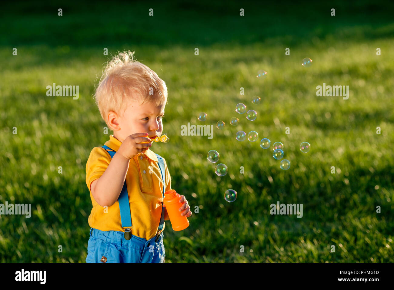 one-year-old-baby-boy-blowing-soap-bubbles-stock-photo-alamy