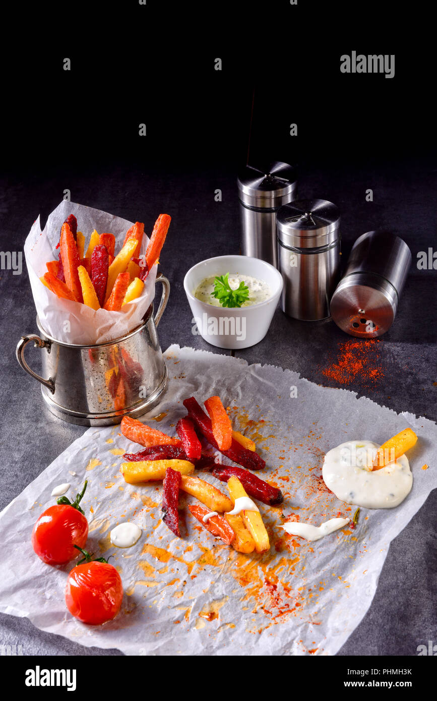 vegetable French fries with herb quark and tomatoes Stock Photo Alamy
