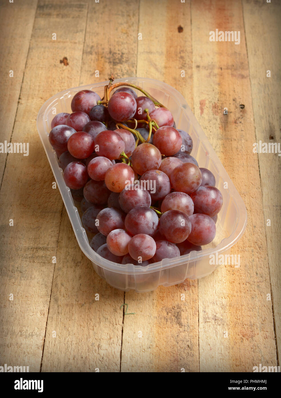 Download Pile Of Dark Grapes In The Plastic Container Closeup Stock Photo Alamy PSD Mockup Templates