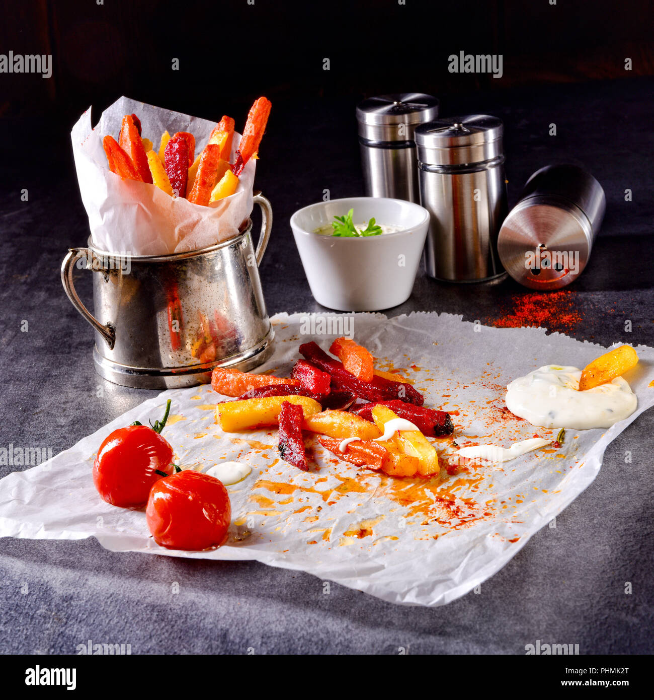 vegetable French fries with herb quark and tomatoes Stock Photo Alamy