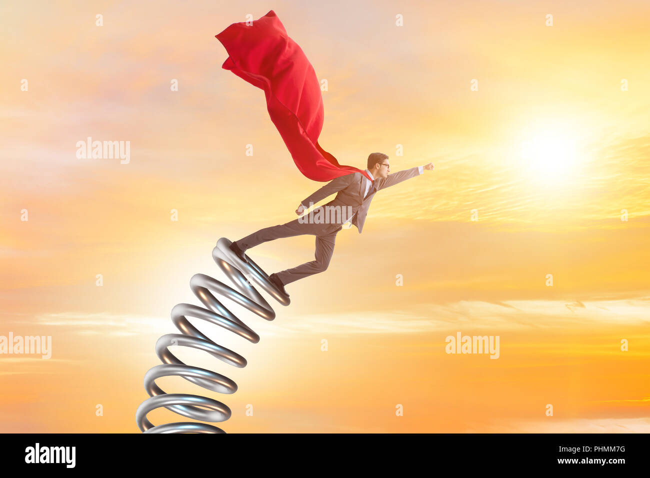 Businessman jumping from spring in promotion concept Stock Photo - Alamy