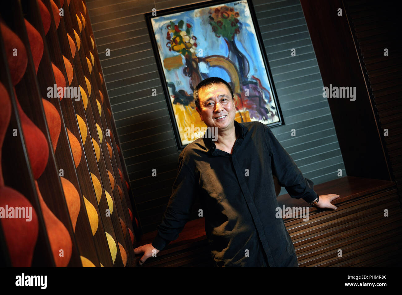 Chef Nobu Matsuhisa Poses In Front Of A Painting By The Father Of His Business Partner American Actor Robert De Niro At His Restaurant In Central To Stock Photo Alamy