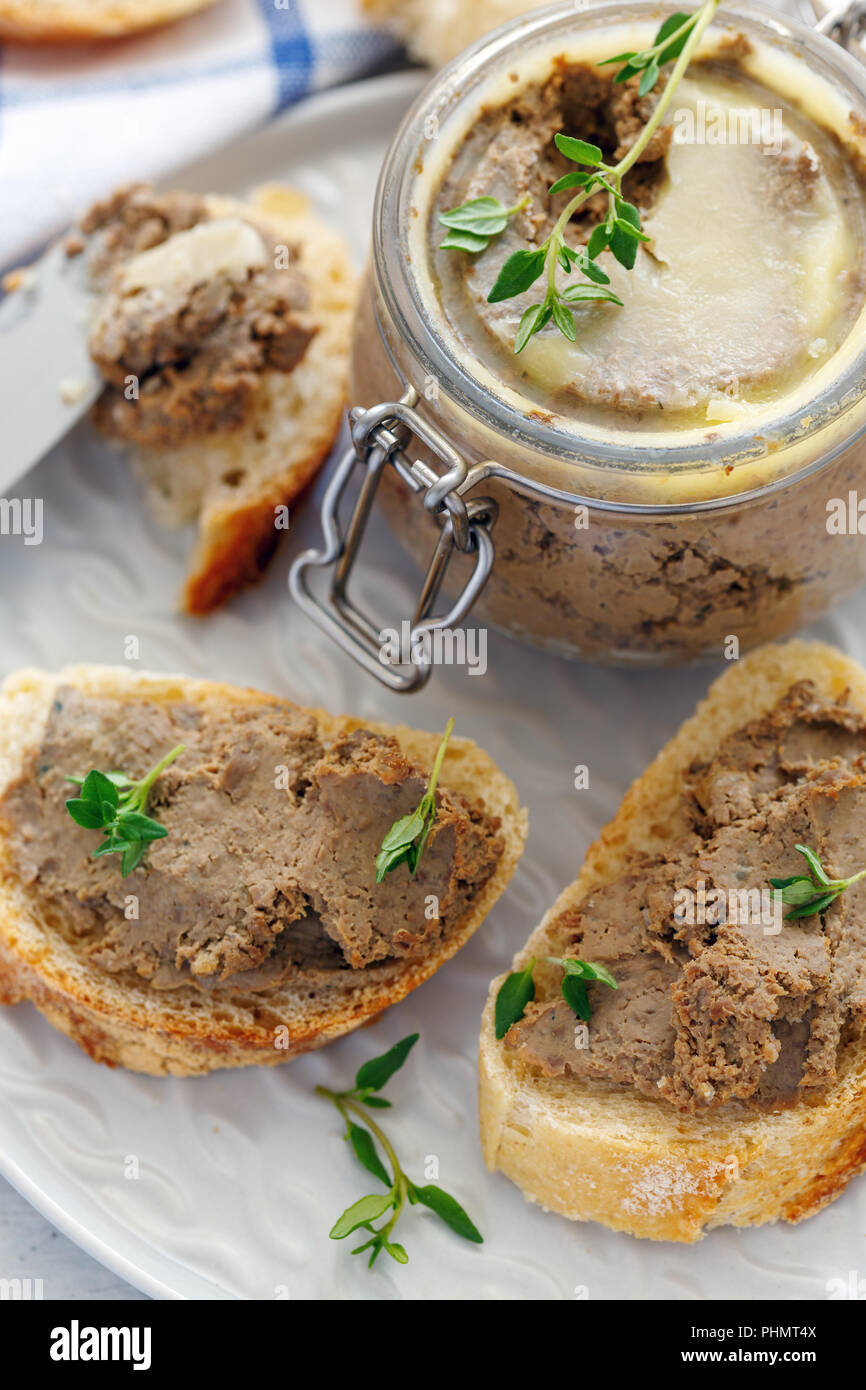 Slices of baguette with homemade liver pate. Stock Photo