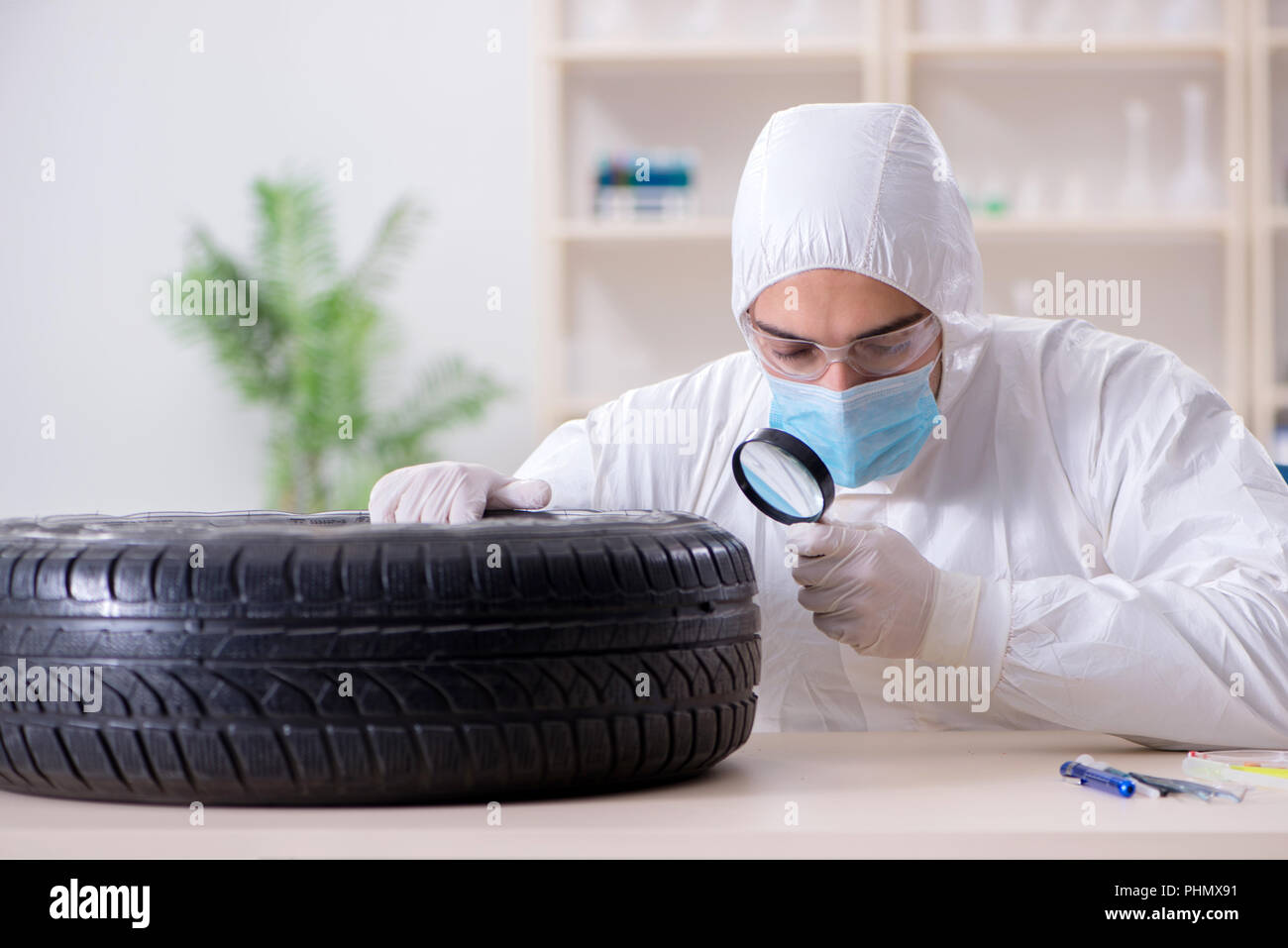 Expert is looking at car accident evidence Stock Photo Alamy