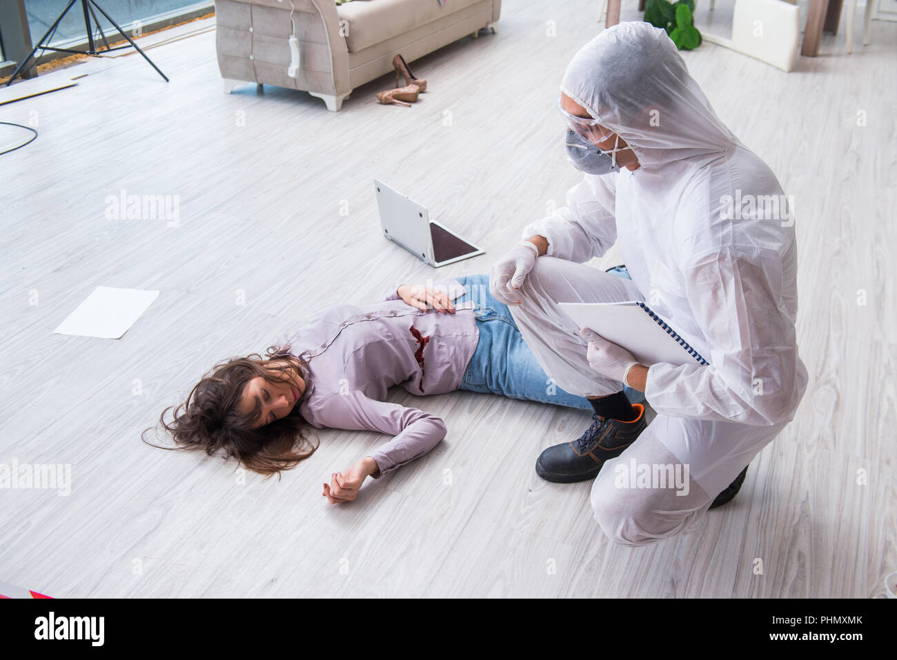 Forensic investigator at the crime scene investigating woman mur Stock ...