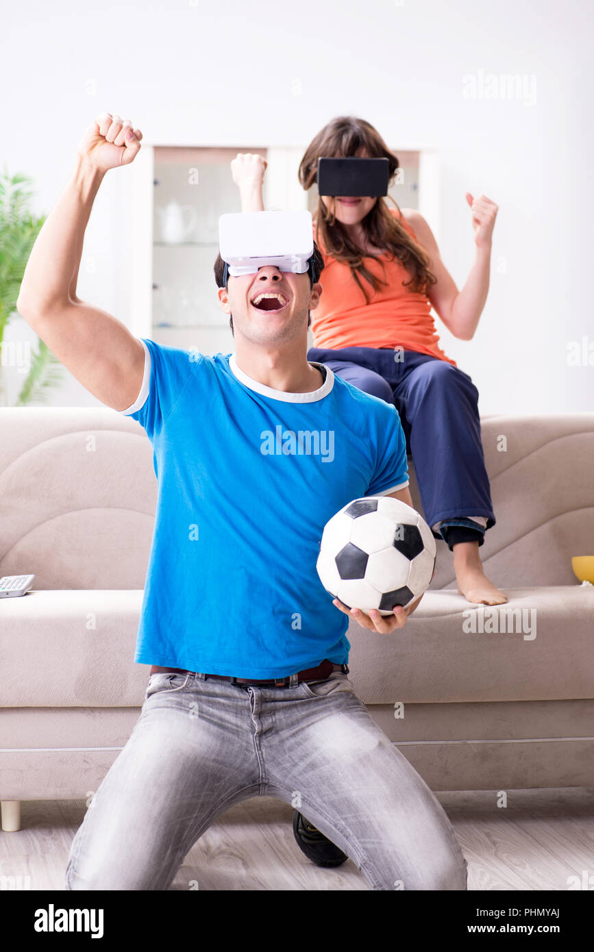 Man watching football on virtual reality vr glasses Stock Photo Alamy