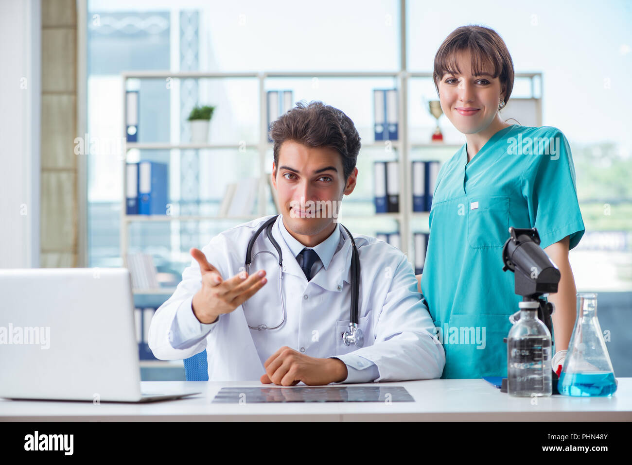 Two doctors consulting computer hi-res stock photography and images - Alamy