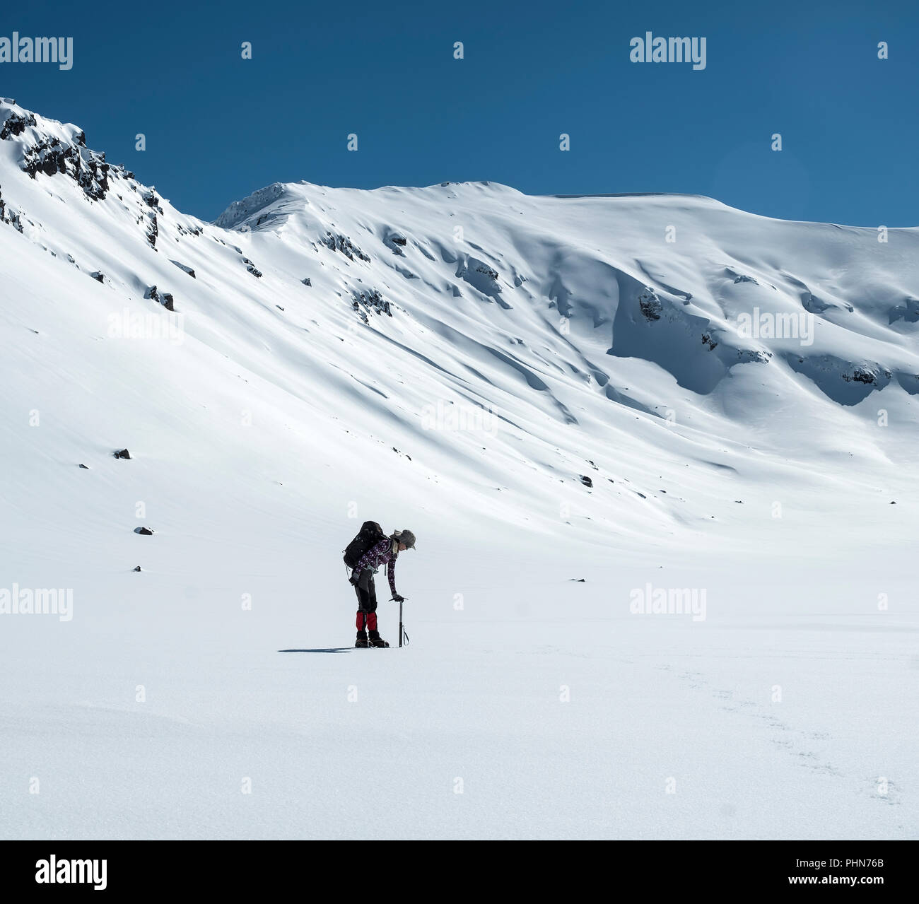 woman winter mountain walking in New Zealand National Park, Tongariro crossing Stock Photo