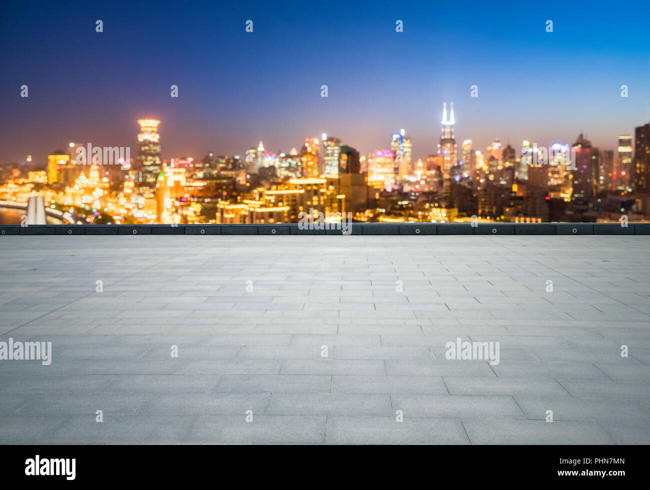 empty brick floor with dreamlike cityscape Stock Photo