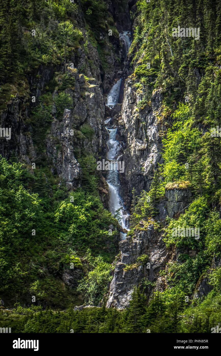 small waterfalls on mountain slopes in alaska mountains Stock Photo
