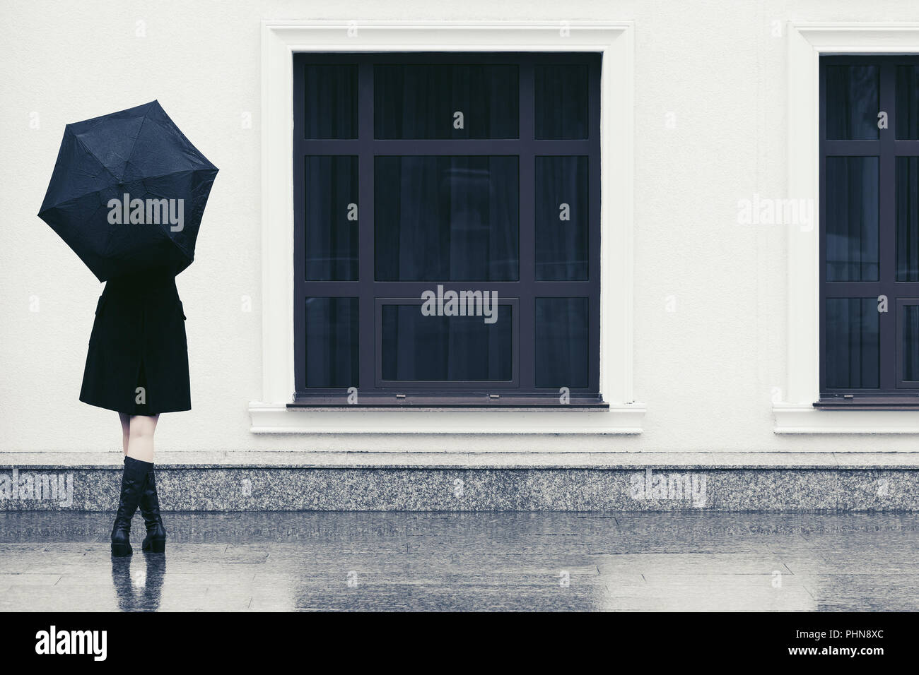 Fashion woman with umbrella walking in city street Stock Photo - Alamy