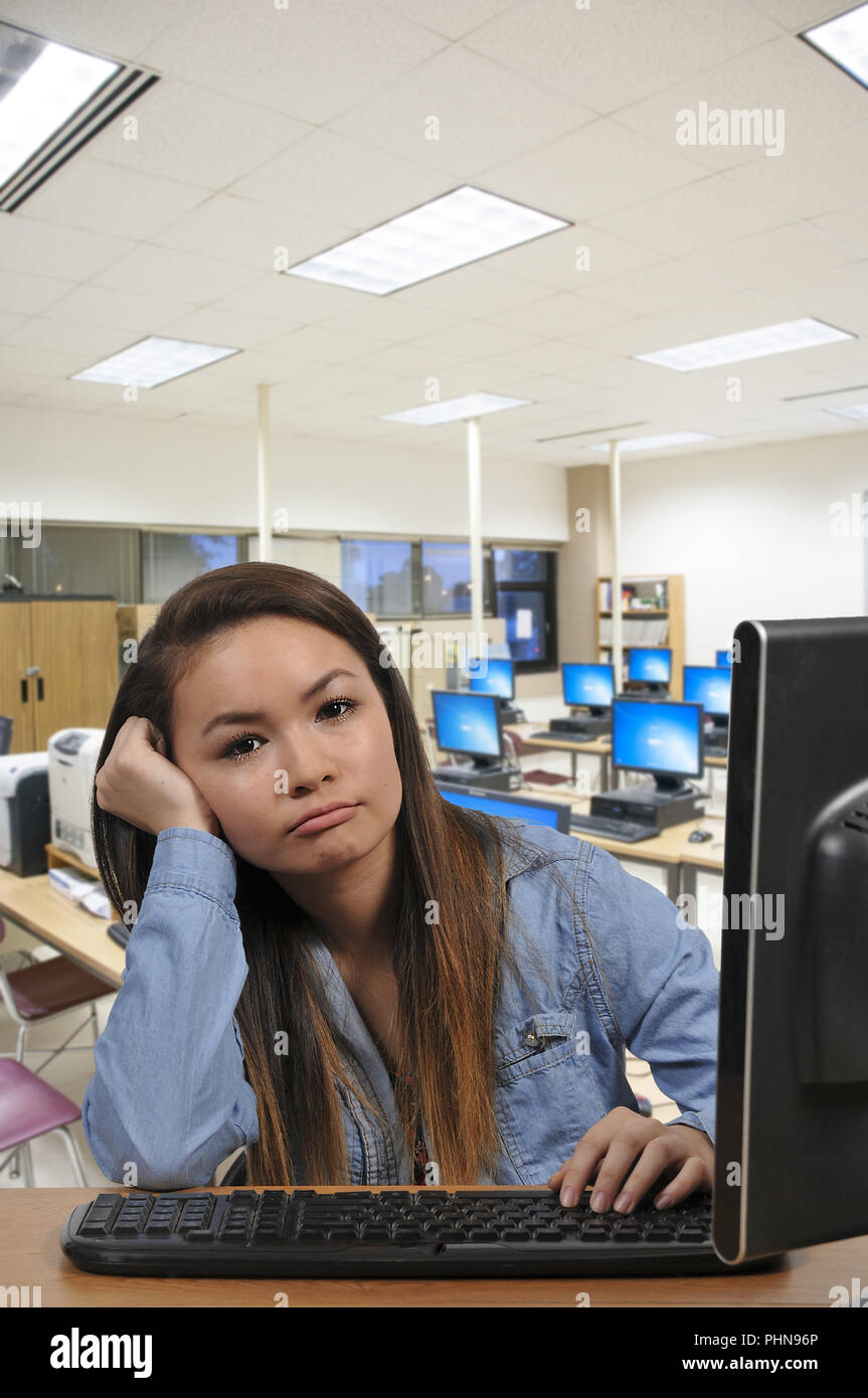 Teenabe girl on desktop computer Stock Photo - Alamy