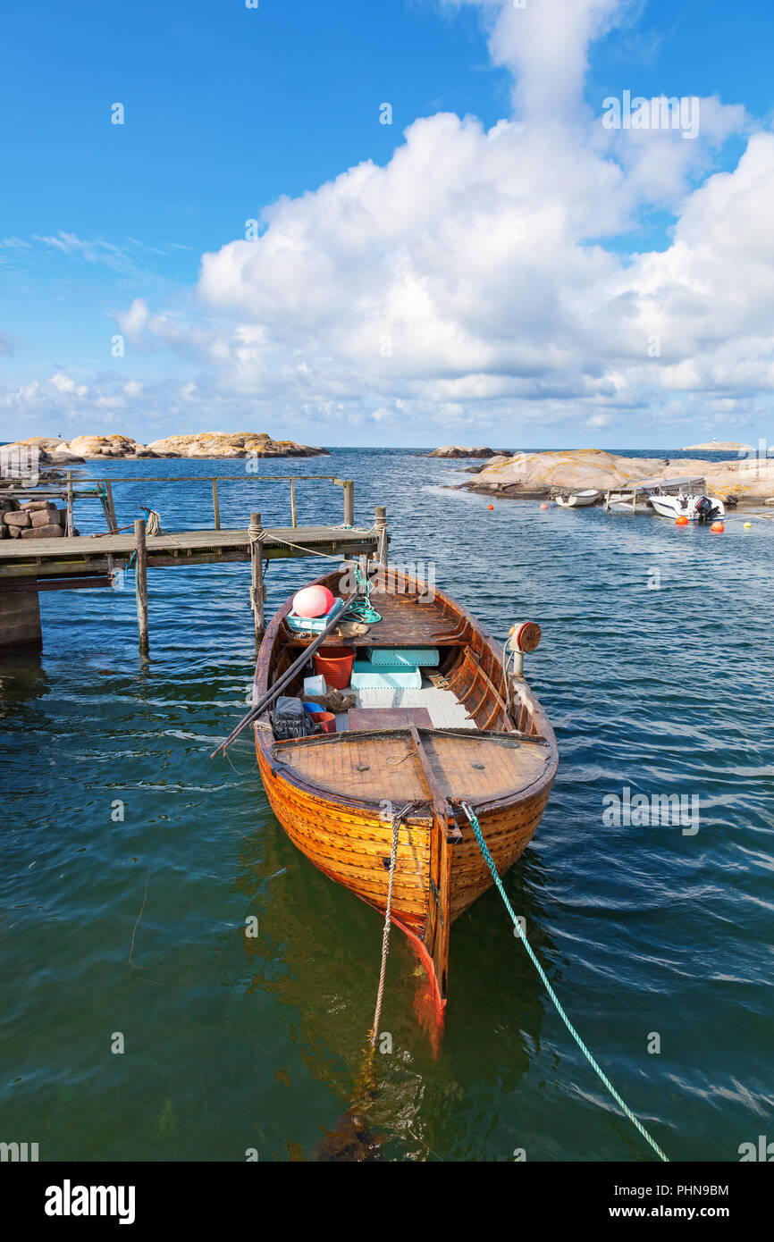 Old fishing boat moored at the pier Stock Photo - Alamy