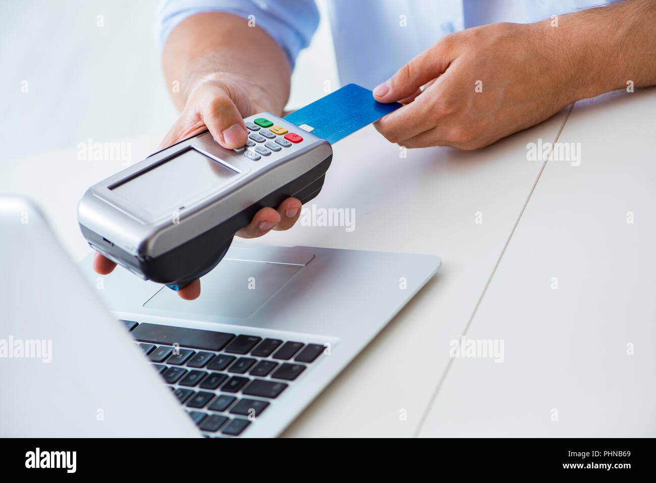 Man processing credit card transaction with POS terminal Stock Photo ...