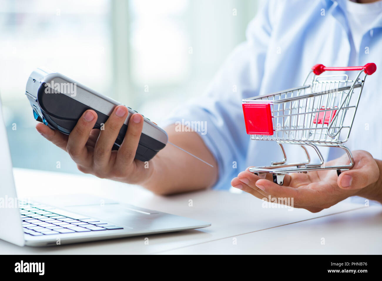 Paying for online purchase with credit at POS Stock Photo Alamy