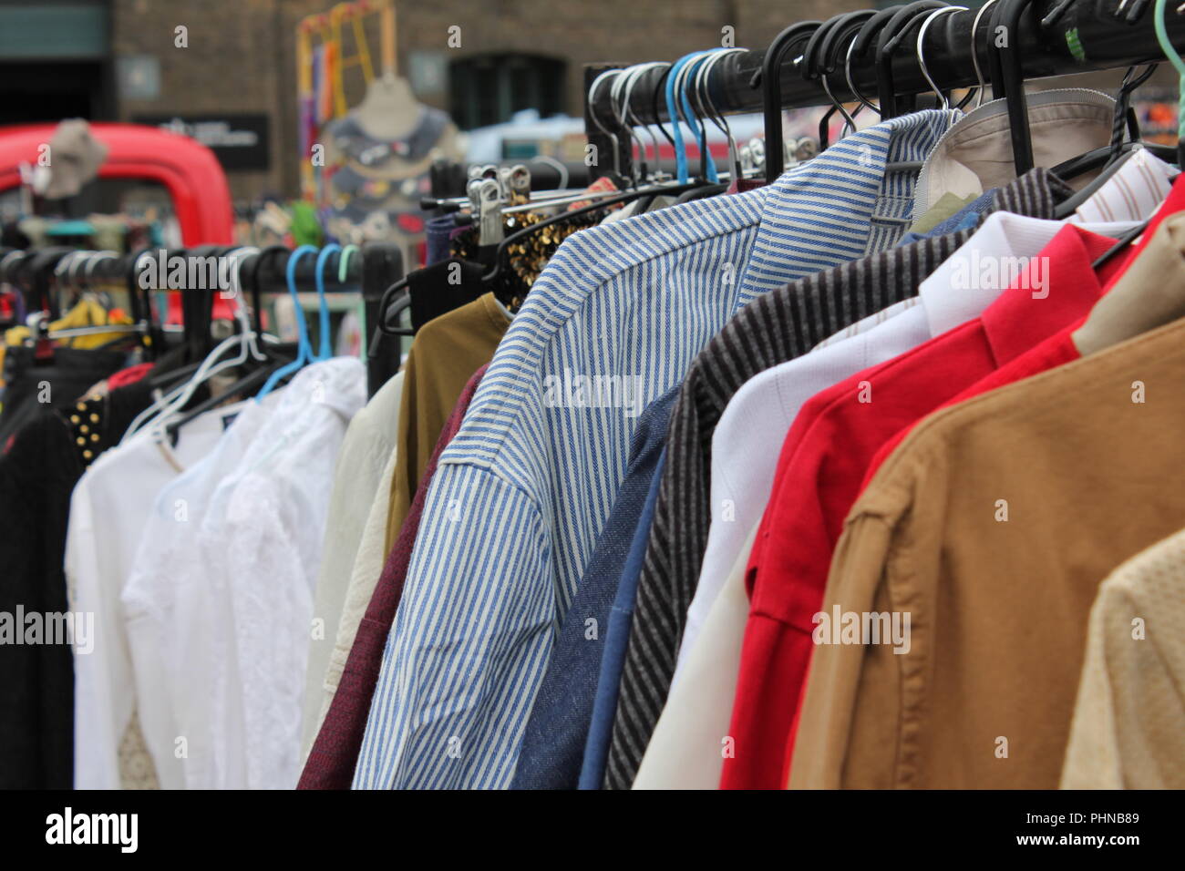 Vintage Clothing Hanging On A Rail Shirts Stripes Classic Car Boot Sale Stock Photo Alamy
