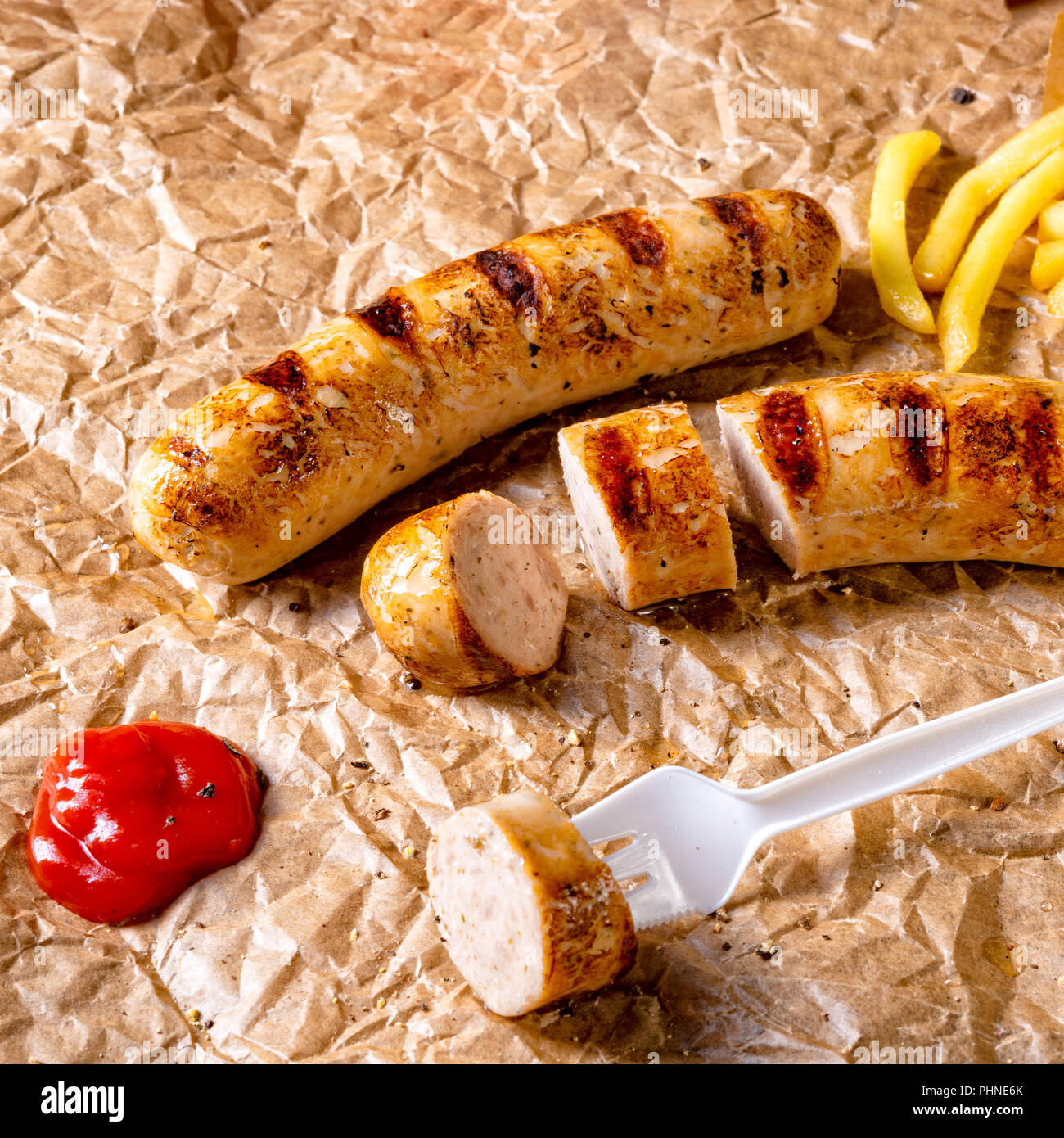 rustic bratwurst with pommes and hot ketchup Stock Photo - Alamy
