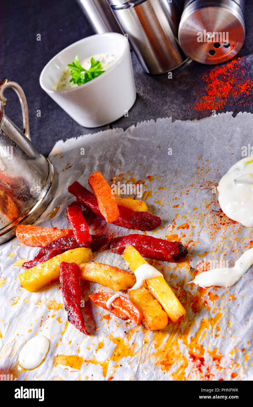 vegetable French fries with herb quark and tomatoes Stock Photo Alamy