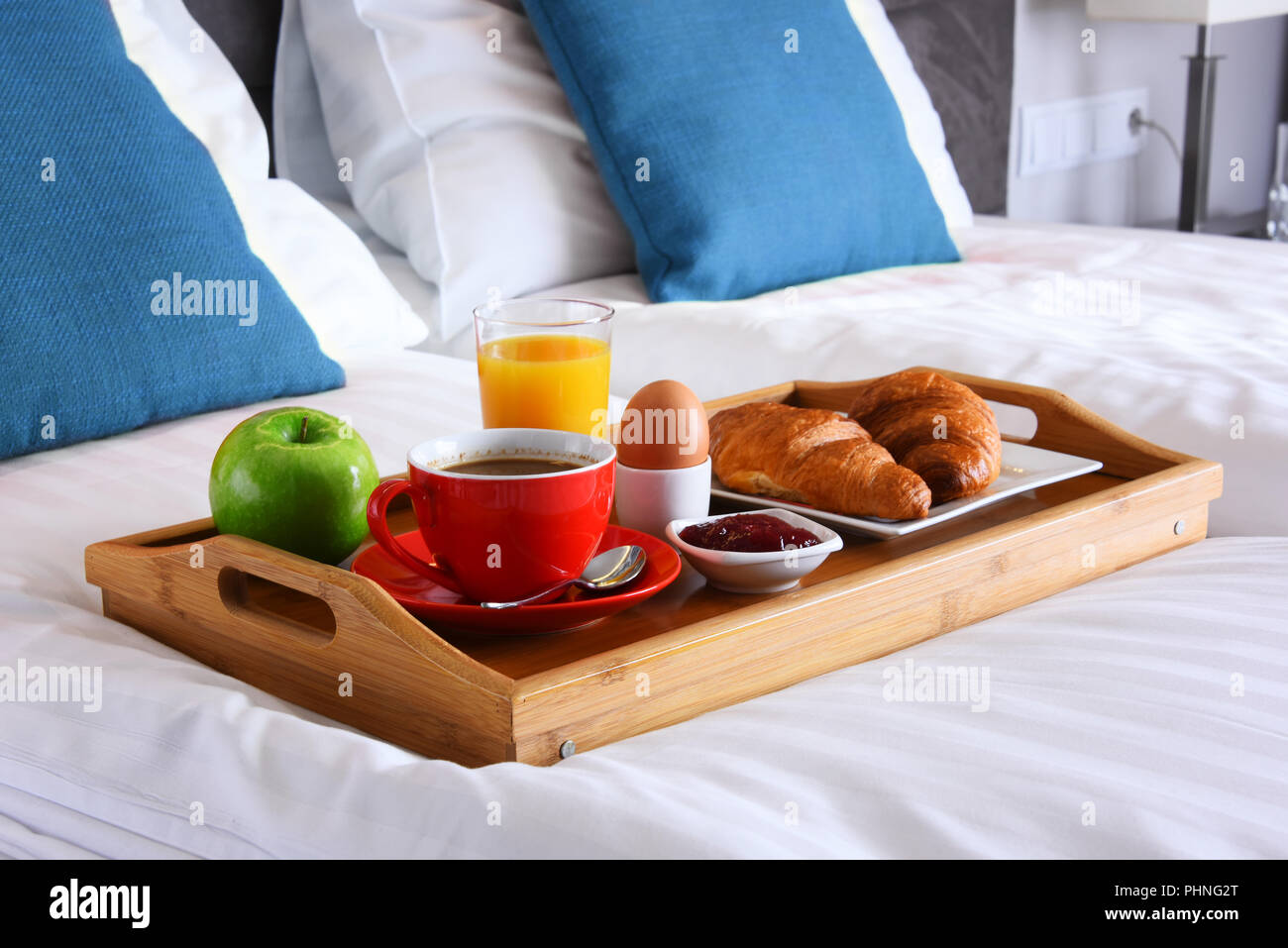 Breakfast on tray in bed in hotel room Stock Photo Alamy