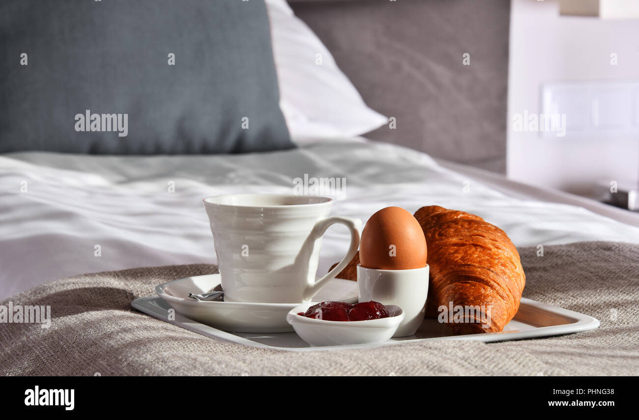 Breakfast on tray in bed in hotel room Stock Photo - Alamy