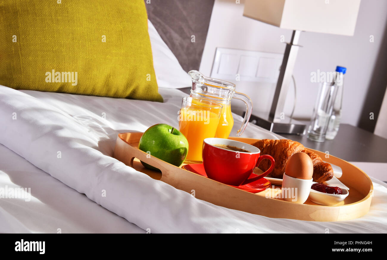 Breakfast on tray in bed in hotel room Stock Photo - Alamy