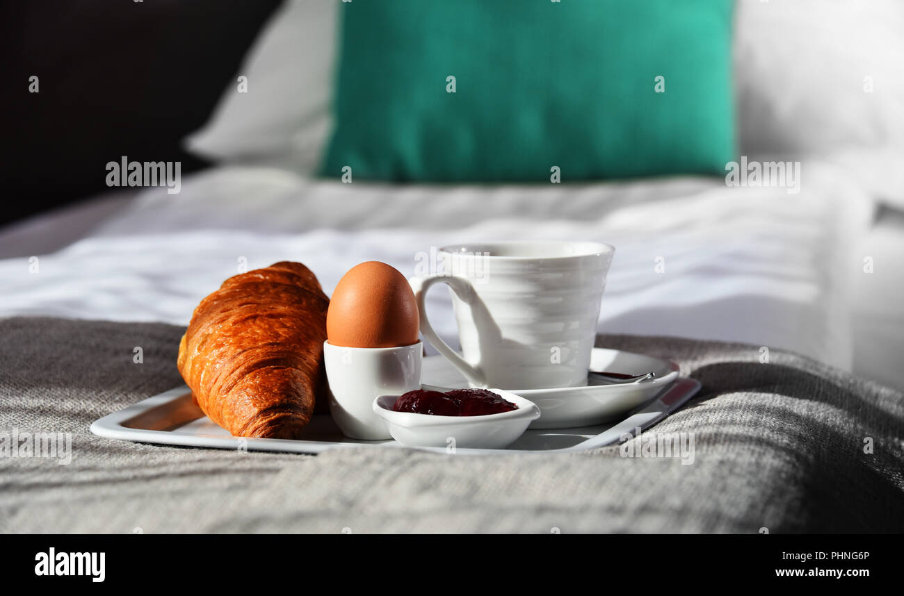 Breakfast on tray in bed in hotel room Stock Photo - Alamy