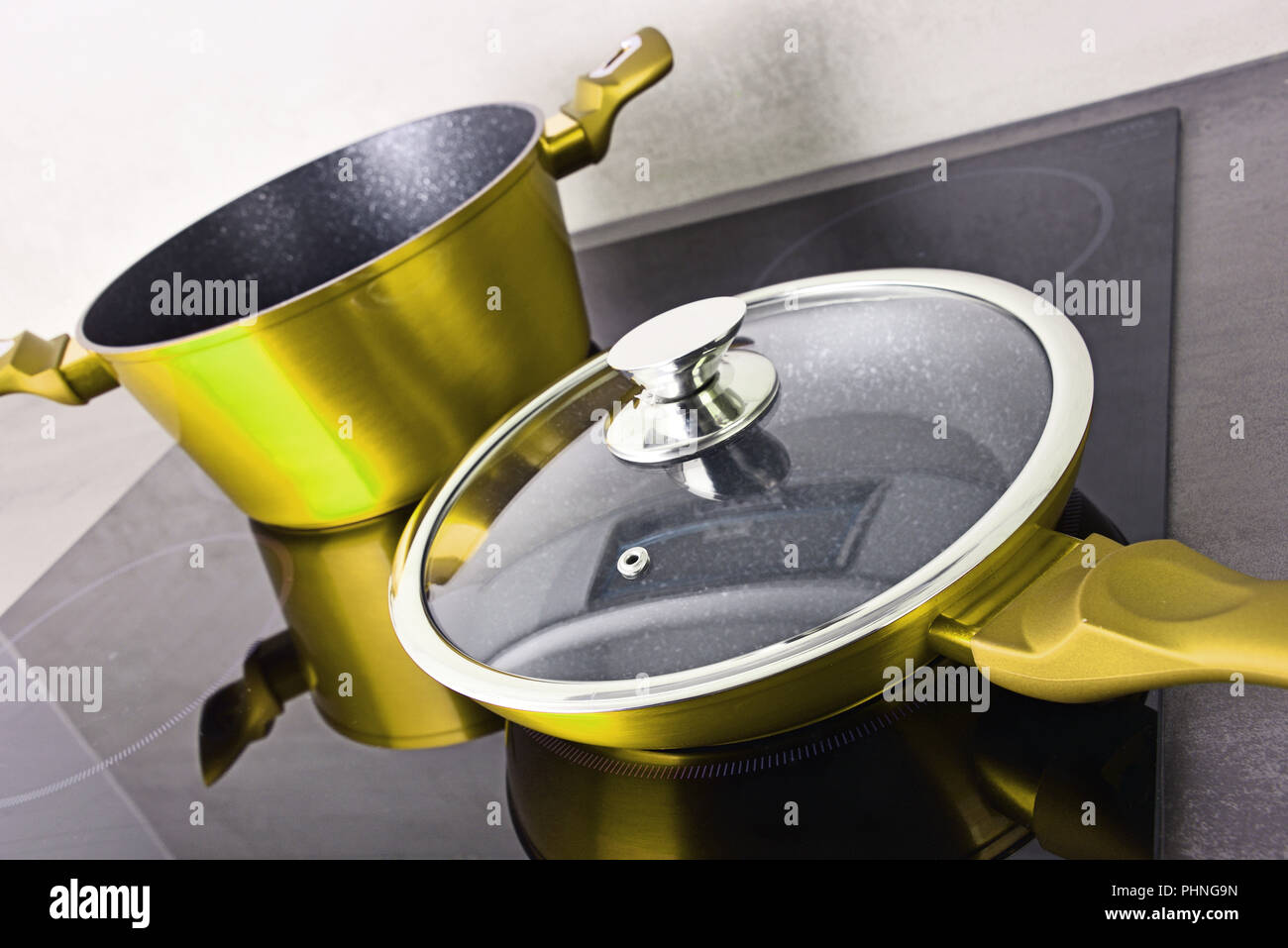 Frying Pan And Steel Pot On Modern Induction Cooktop Stock Photo