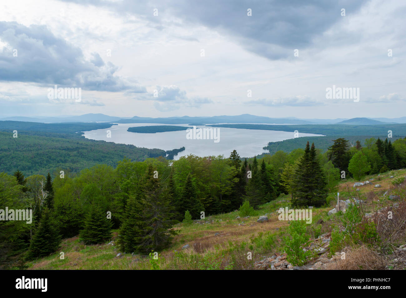 Mooselookmeguntic Lake under a cloudy sky, viewed from Height of Land