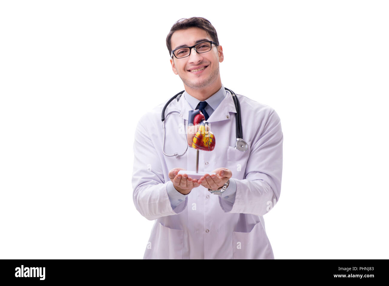 Young doctor with heart shape isolated on white Stock Photo - Alamy