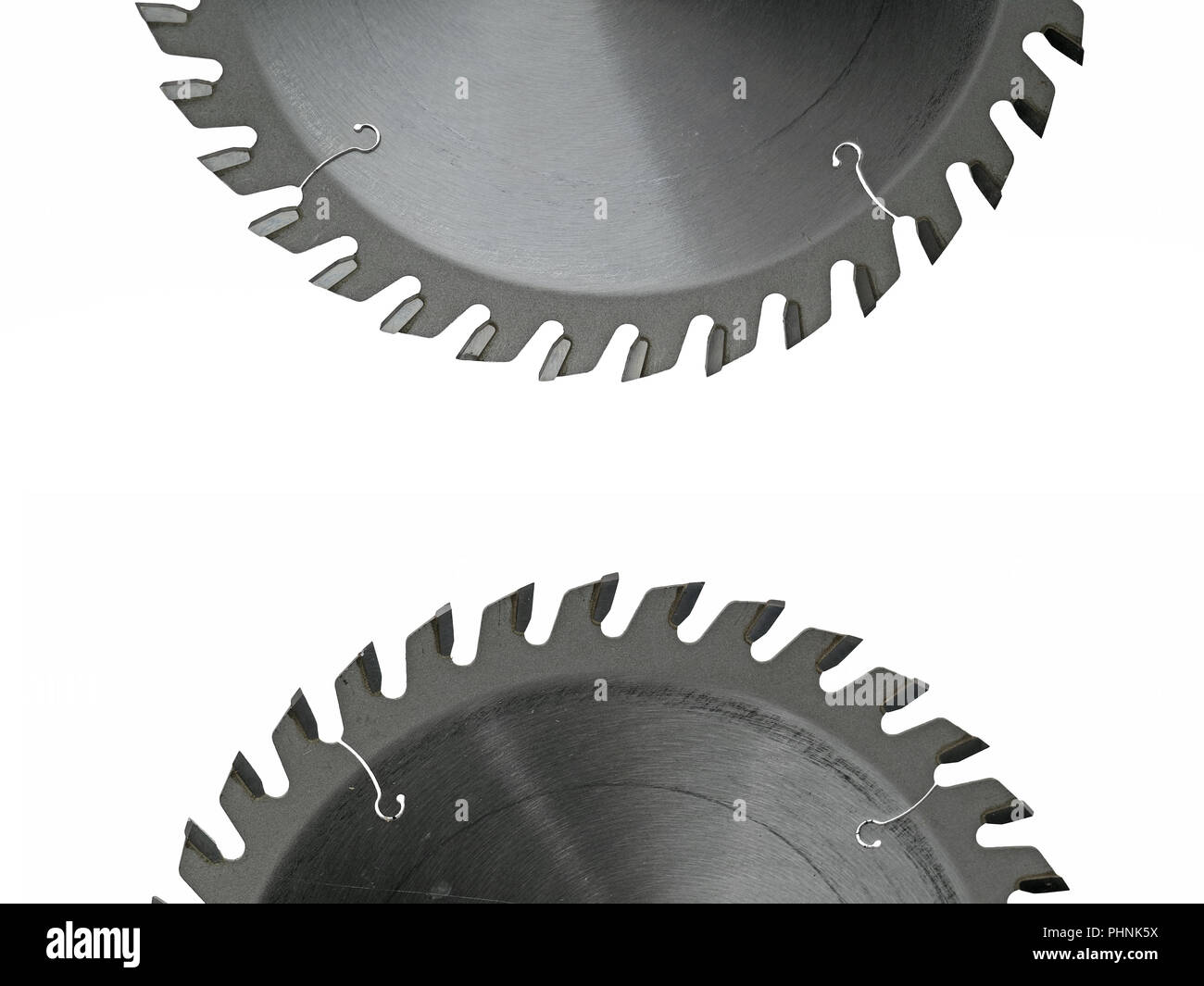 two half circular saw blade for wood isolated on white with copy space in the middle Stock Photo